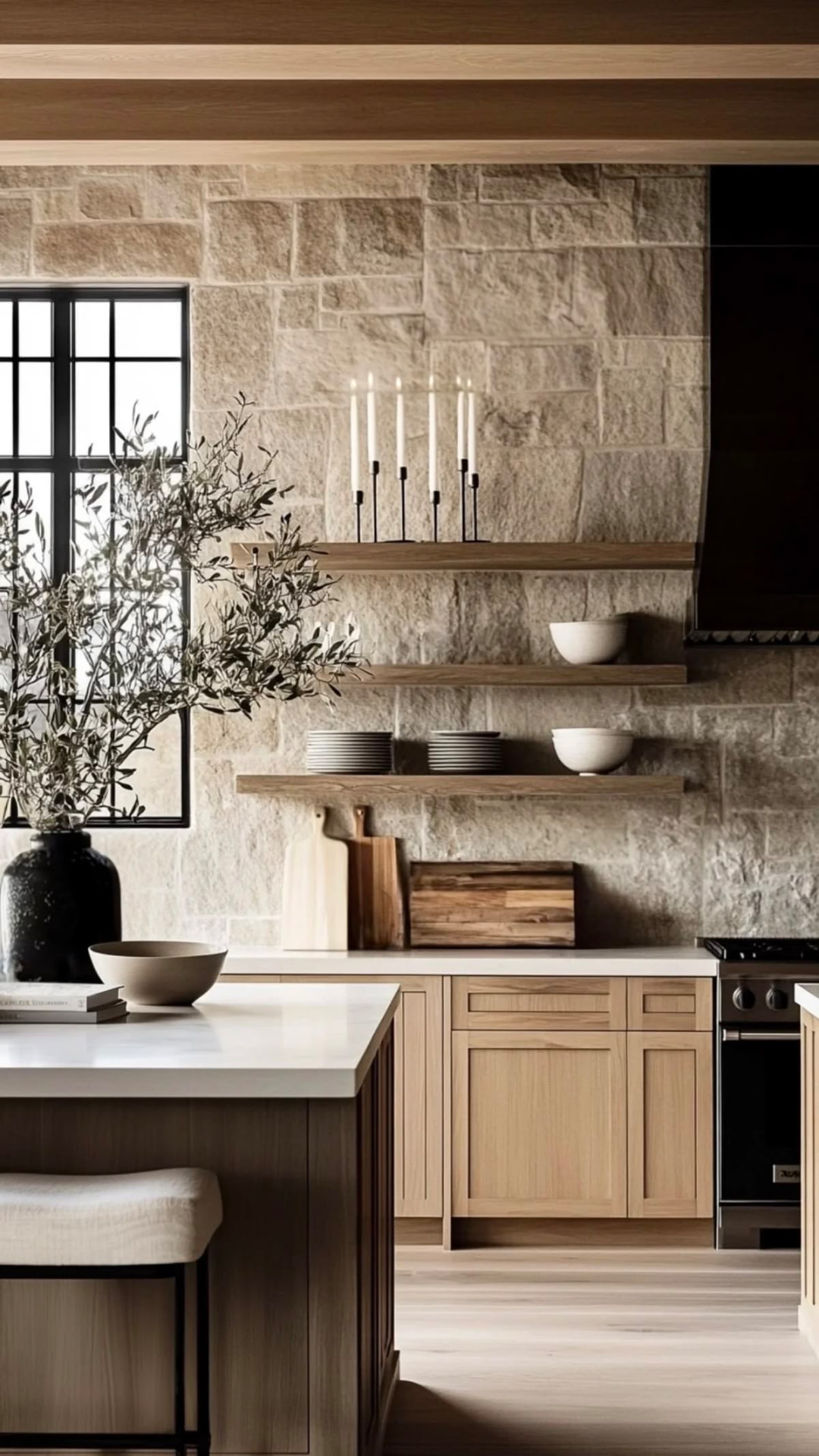 Oak kitchen with stone walls, open shelving and a pale island